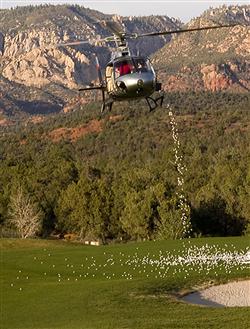 A Maverick helicopter will drop thousands of balls onto the green to determine the eight prize winners.